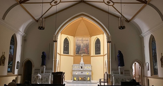 Interior sanctuary and main altar of Saint Patrick Catholic Church in Church Hill, Richmond